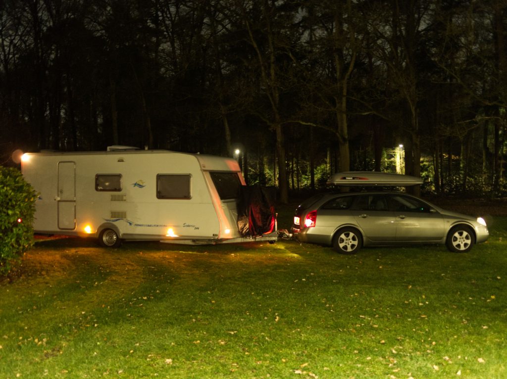 The full setup - car and caravan - sitting ready to depart in the evening